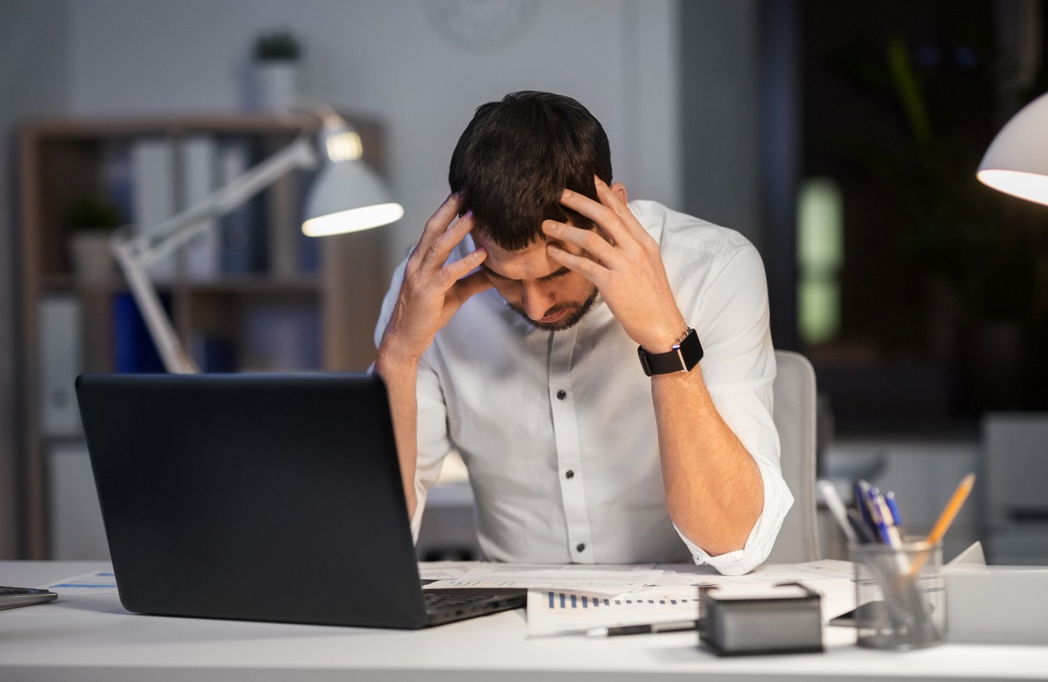 Frustrated Businessman Working at Night 